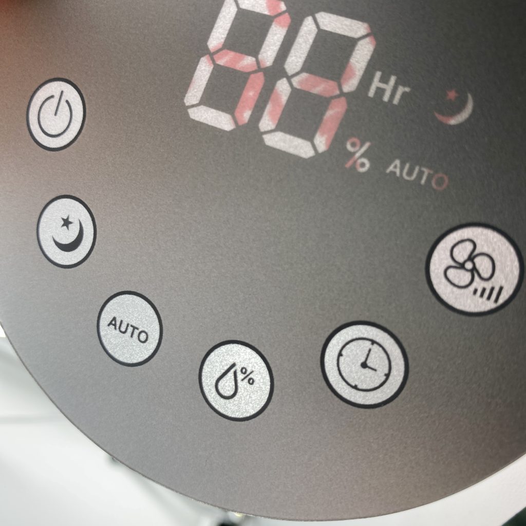 Close-up of dead-front printing and backlit LED display on a capacitive touch graphic overlay