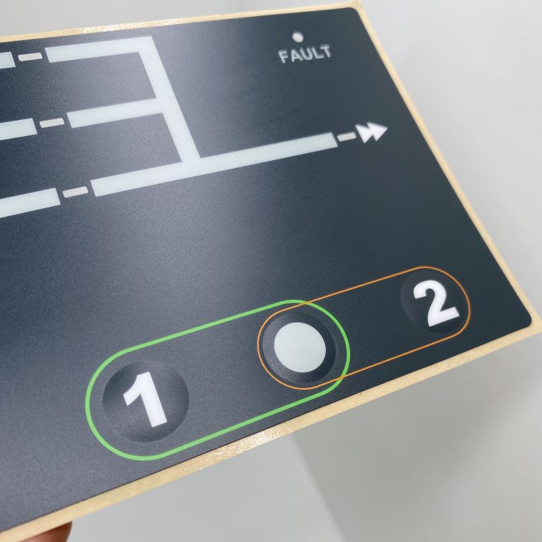 Close-up of buttons on a custom electronic graphic overlay